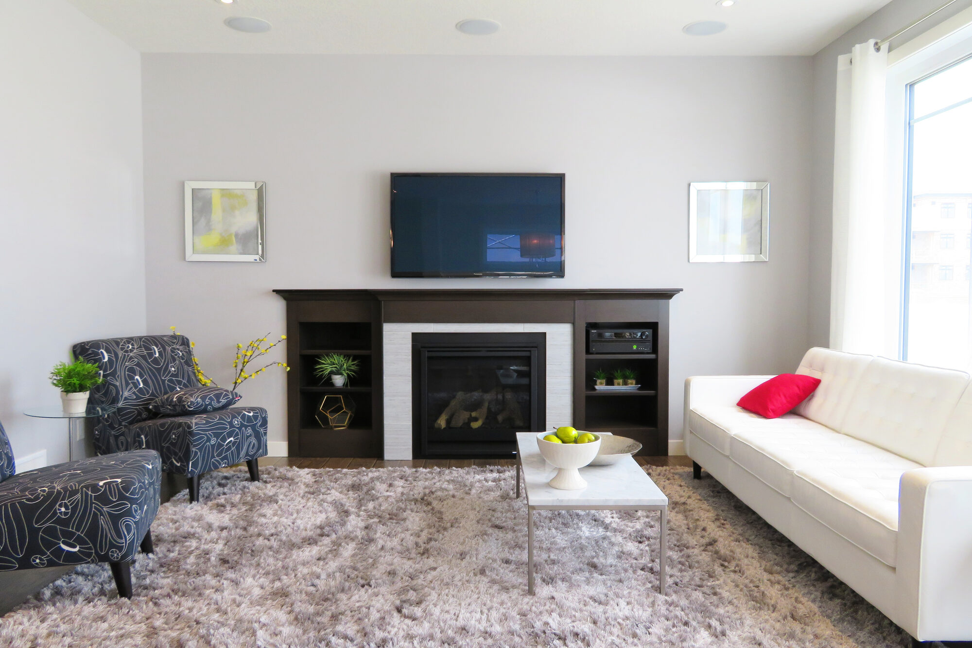 A warm living room with a fireplace (representative photo — pictures of the actual home are coming)