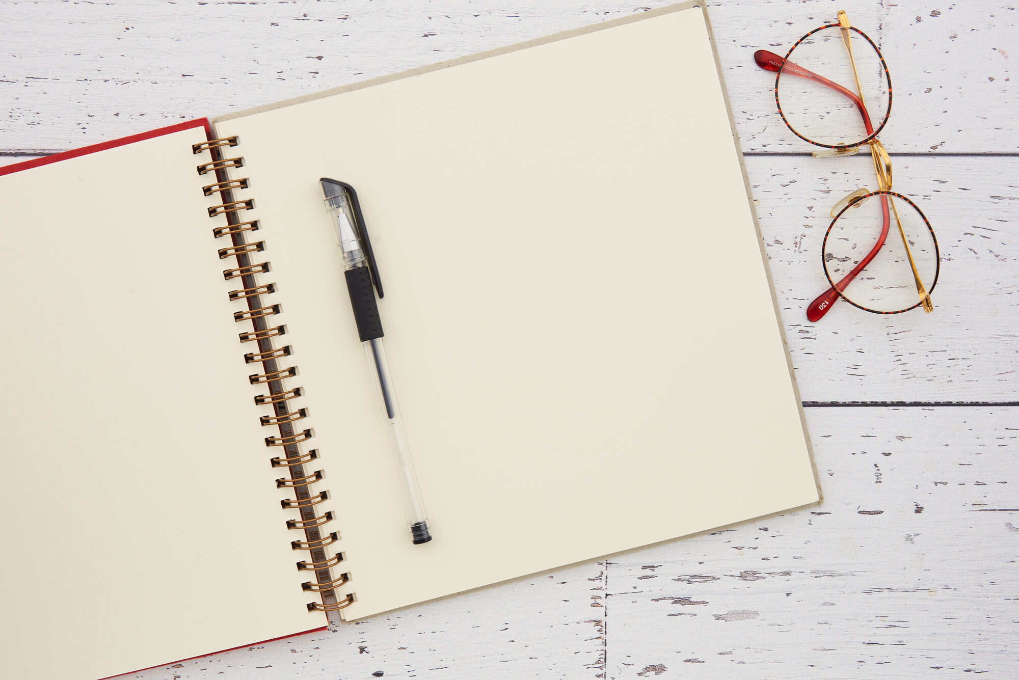 A notebook and reading glasses (representative photo — pictures of the actual home are coming)